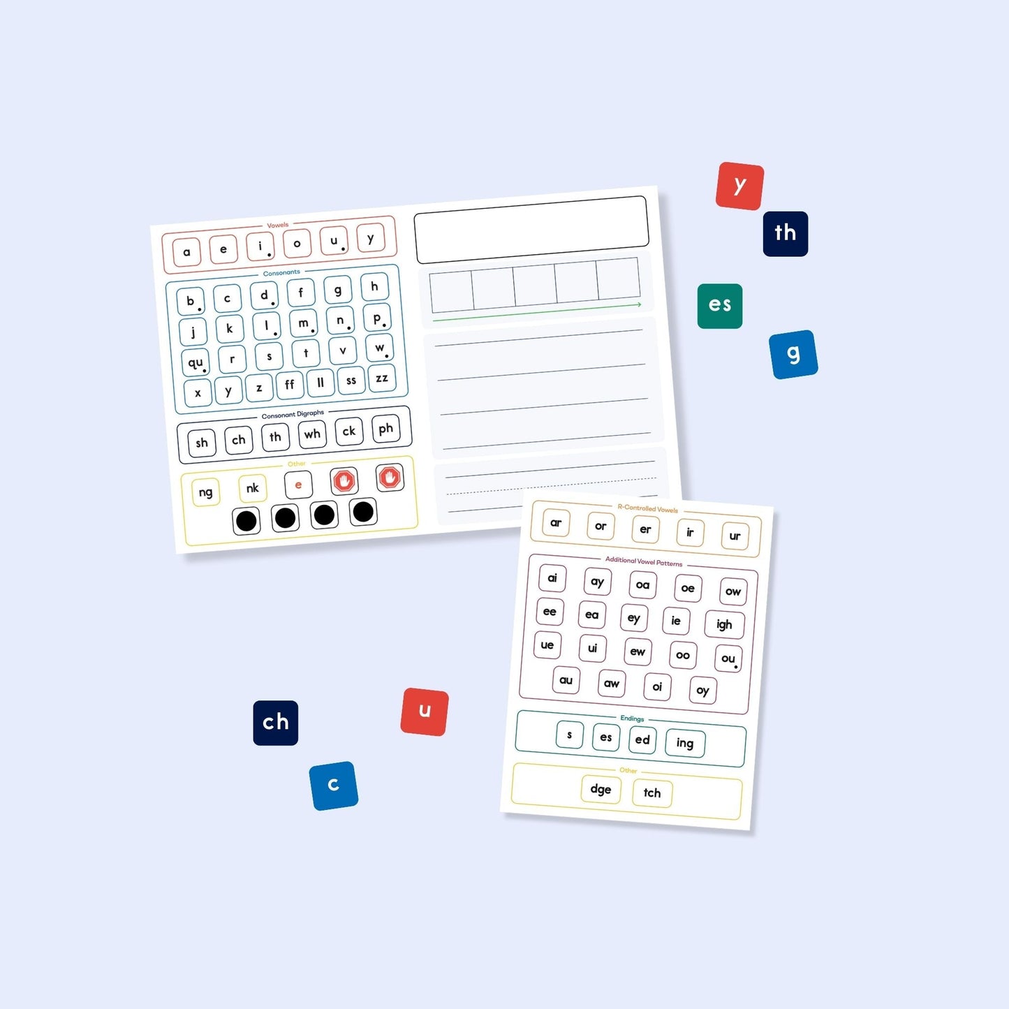 Color-coded magnetic phonics tiles and alphabet letters used with spelling activity sheets for small group instruction.