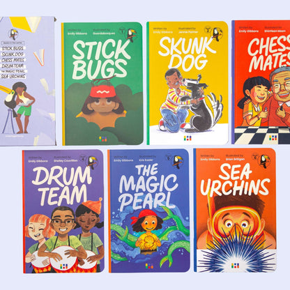 Collection of children's books with colorful covers on a light purple background