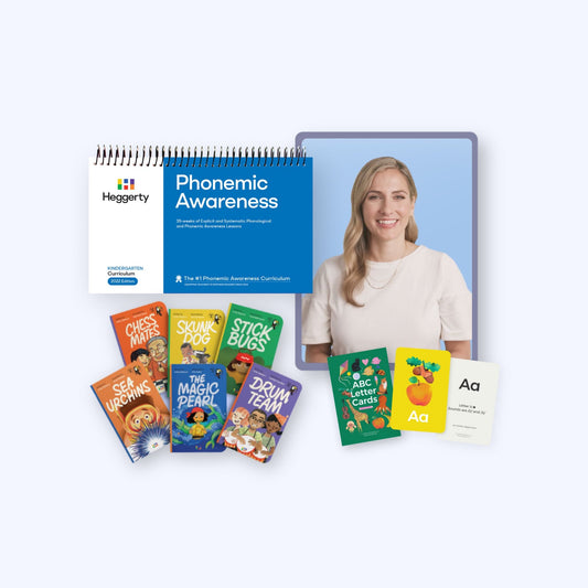 Complete Heggerty Kindergarten Phonemic Awareness bundle including the blue curriculum book, teacher guide, six decodable readers, ABC letter cards, and alphabet flashcards.